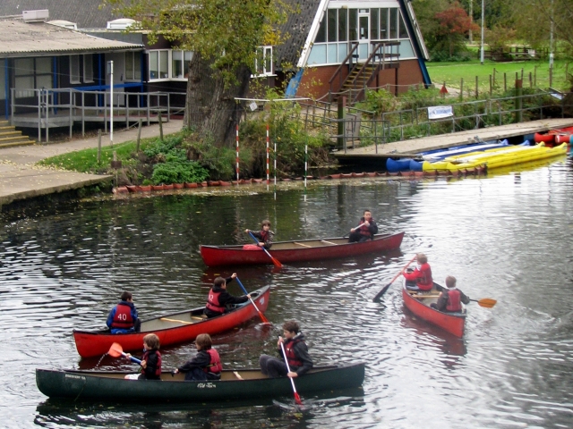 A canoe can carry up to three people at the same time